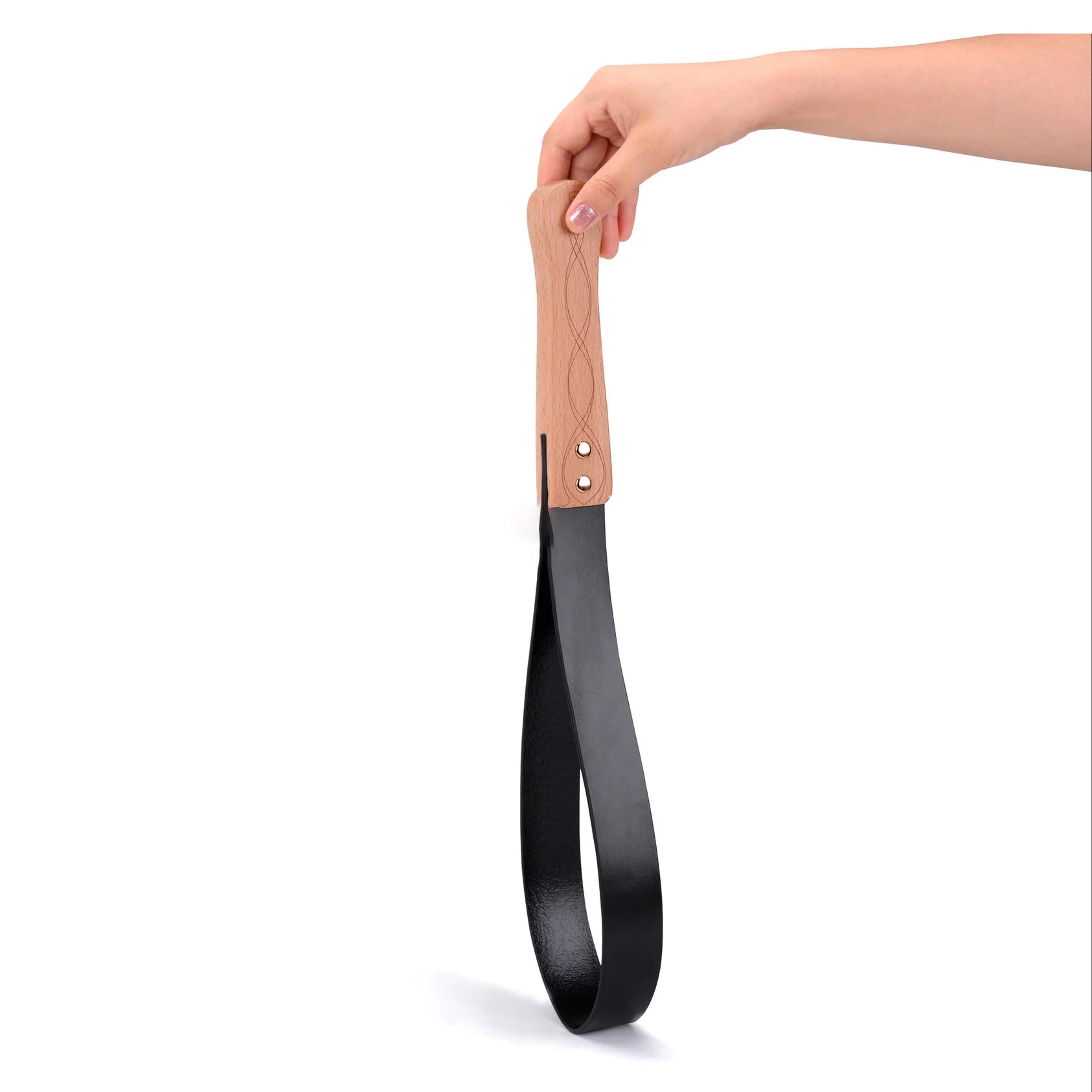 Black leather BDSM paddle with wood handle on white background