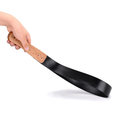 Black leather paddle with carved wood handle full view