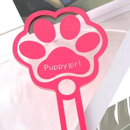 Close detail of pink acrylic cat paw paddle head