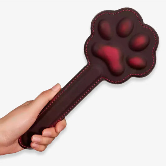 Handheld color-changing cat paw spanking board showing compact design