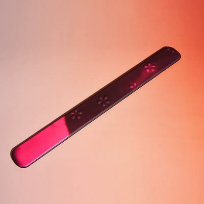 Close-up of thermo-reactive black to rose color shift on rule paddle