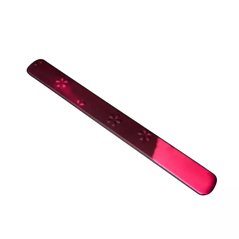 Thermo-reactive rule-style spanking paddle on white background