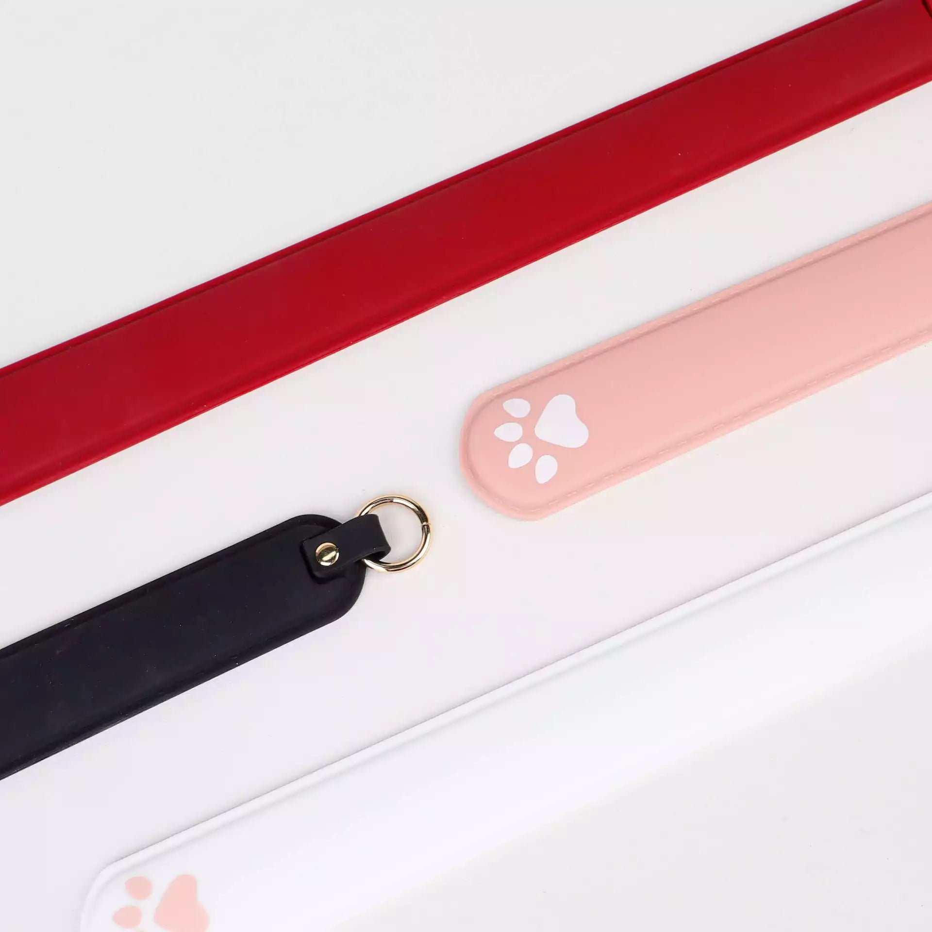 Silicone cat paw paddles displayed in themed scene