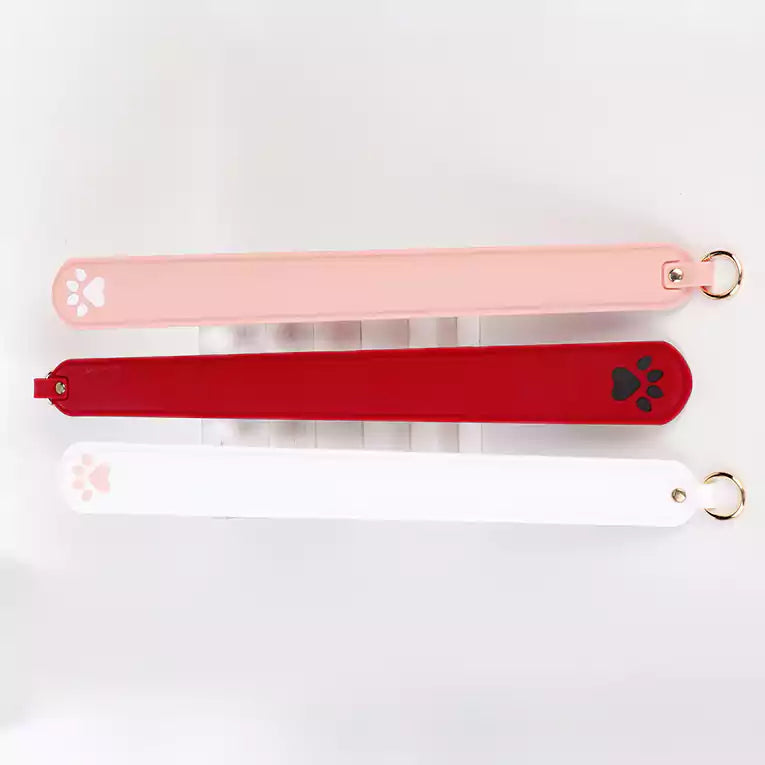 Top view of silicone cat paw paddle showing strike tip shape