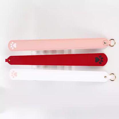 Top view of silicone cat paw paddle showing strike tip shape