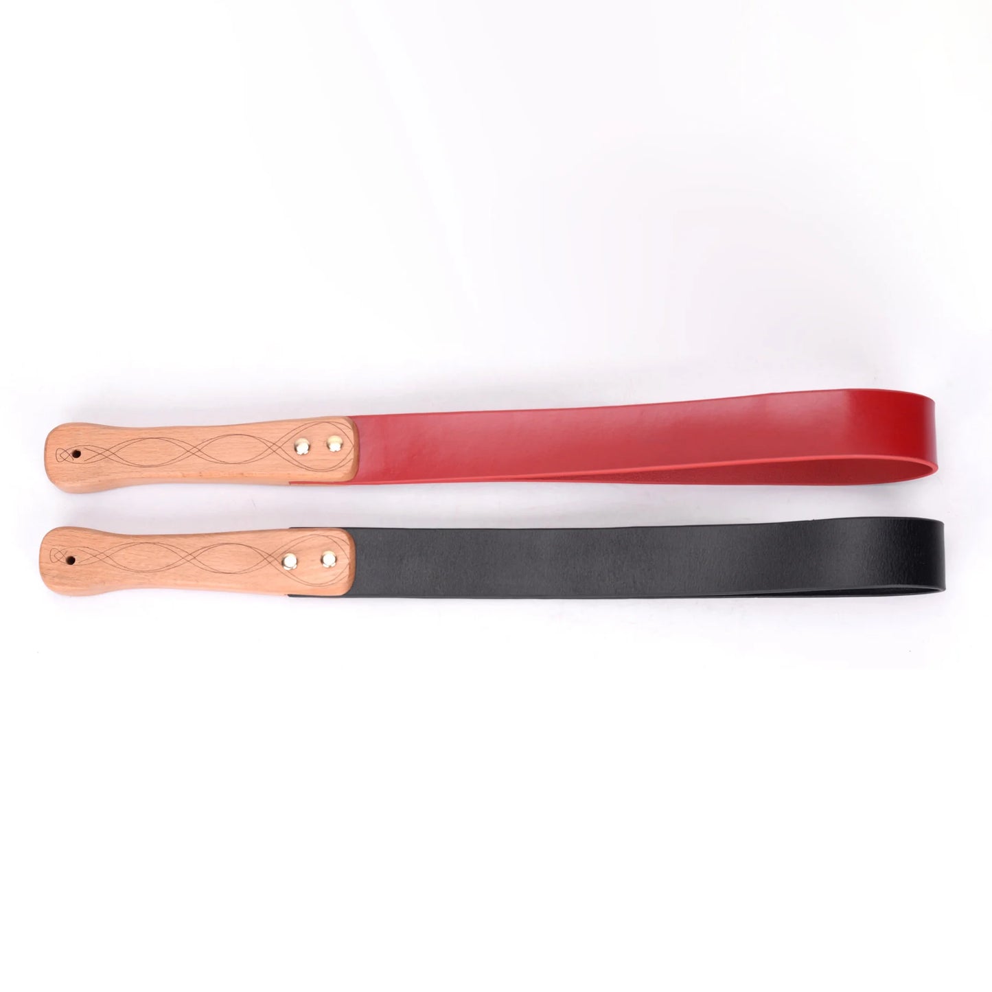 Black and red leather paddles with carved wood handles full view