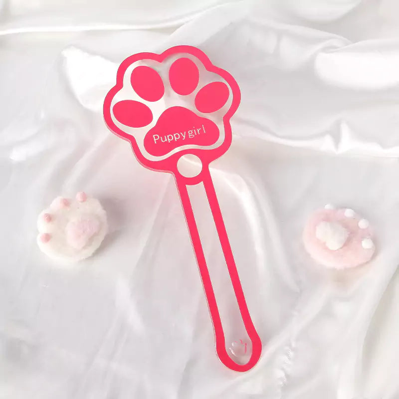 Pink acrylic cat paw spanking paddle styled scene view